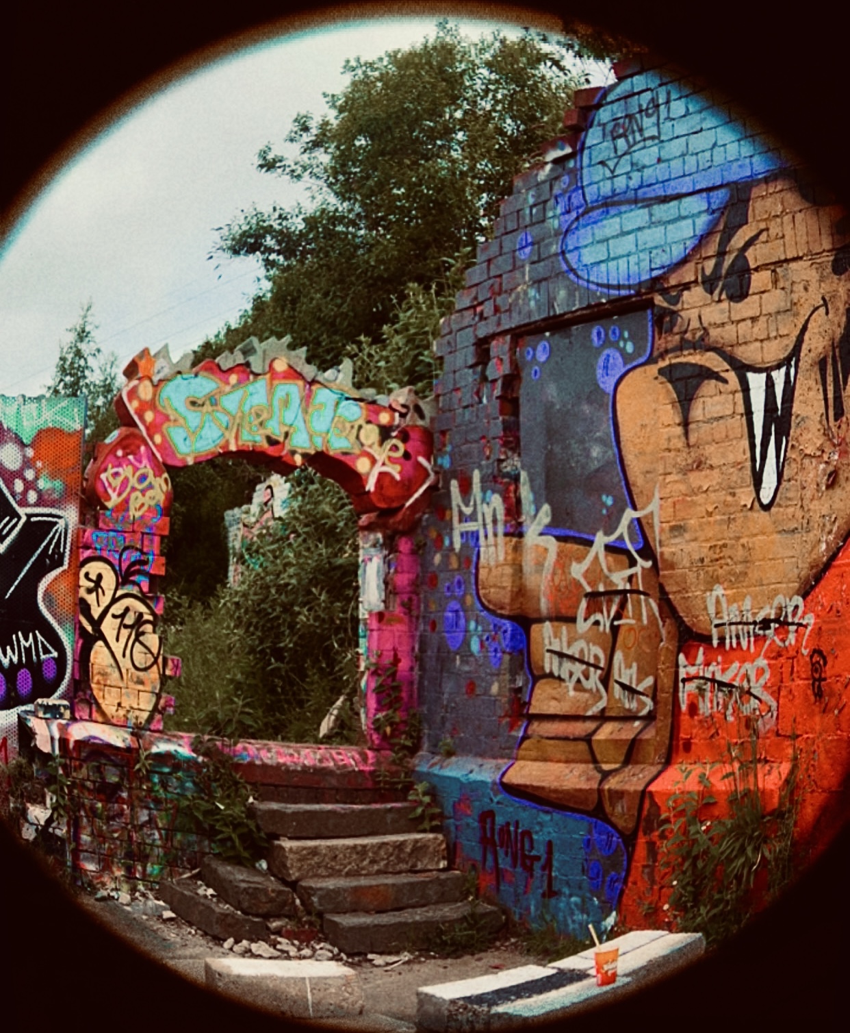 Entrance to arches covered in graffiti