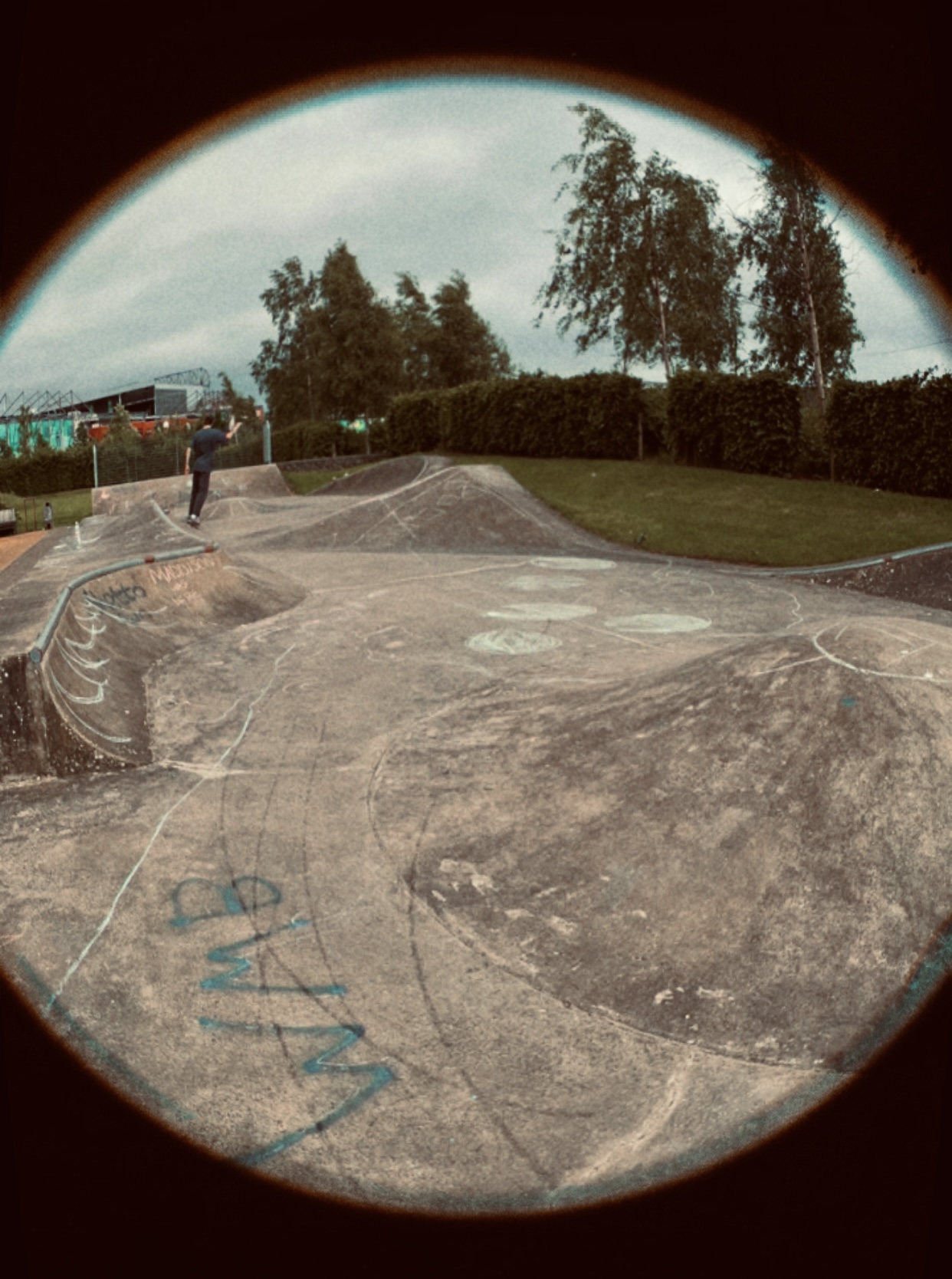 skateboarder riding through the park